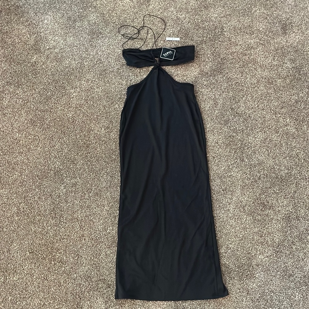 New with tag. Medium dress with slit up the back
